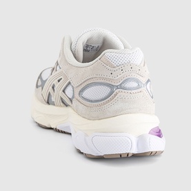 Asics trainer in white and taro purple, suede and mesh upper, chunky white sole with purple gel detail, rear three-quarter view.