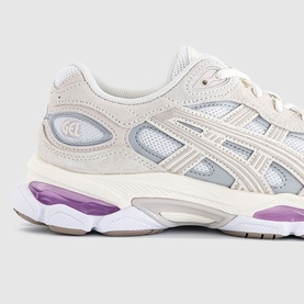 Asics trainer in white and taro purple, featuring mesh upper, suede overlays, GEL branding and chunky purple outsole.