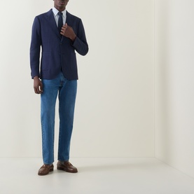 Model wearing Gant Patch Pocket Single-Breasted Blazer in evening blue, styled with light blue trousers, white shirt, tie, and brown loafers.