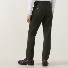 Model wearing Gant Dark Moss Green chinos, rear view, styled with a white shirt and dark burgundy leather shoes.