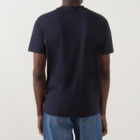 Model wearing Gant Evening Blue cotton crew neck T-shirt, back view, styled with light blue denim jeans.