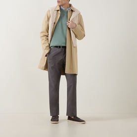 Model wearing Gant Surplus Mint Crew Neck knit, styled with a beige mac coat, dark grey trousers and navy loafers.