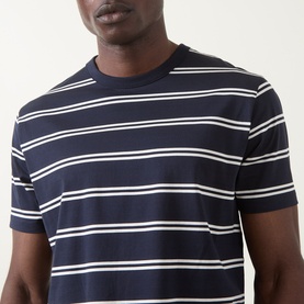 Model wearing Gant Pima Striped T-Shirt in Evening Blue with white stripes, crew neck, short sleeves, close-up chest shot.