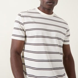 Model wearing Gant Crew Neck T in cream with navy horizontal stripes, short sleeves and ribbed collar.