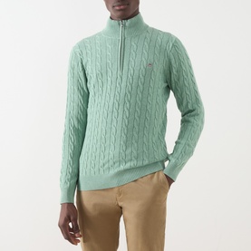 Model wearing Gant Soft Green Melange cotton cable-knit half-zip jumper with logo detail, styled with beige chinos.