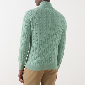Model wearing Gant Soft Green Melange Cotton Cable Knit Half Zip jumper, back view, styled with khaki trousers.