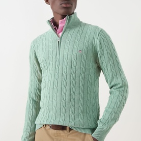 Model wearing Gant Soft Green Melange cotton cable-knit half-zip jumper, styled with pink check shirt and beige chinos.