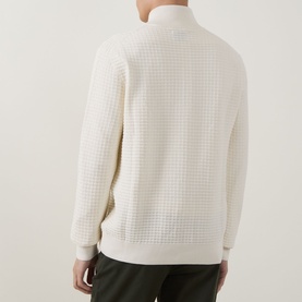Model wearing Gant Logo Textured Half-Zip Sweater in cream, showing waffle-knit texture, half-zip collar and ribbed hem, back view.