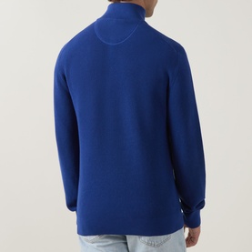 Model wearing Gant Shield Logo Half-Zip Micro Textured Sweatshirt in Crisp Blue, rear view, styled with light-wash jeans.