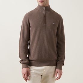 Model wearing Gant Shield Logo Half-Zip Micro Textured Sweatshirt in Dark Hazelnut Melange with funnel neck and shield logo detail.