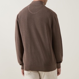 Model wearing Gant Shield Logo Half-Zip Micro Textured Sweatshirt in Dark Hazelnut Melange, back view, with light chinos.