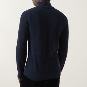 Model wearing Gant Shield Half-Zip Textured Sweater in Evening Blue, showing rear view with waffle knit structure and ribbed trims.