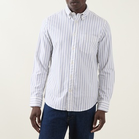 Model wearing Gant Archive Oxford Striped Shirt in cream with button-down collar and chest pocket, styled with blue jeans.