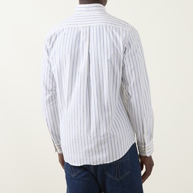 Model wearing Gant Archive Oxford Striped Shirt in cream, rear view showing navy stripes, curved hemline and long sleeves, styled with blue jeans.