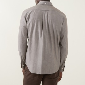 Model wearing Gant Reg Shirt in brown melange, rear view showing box pleat, button-down collar and long sleeves with button cuffs.