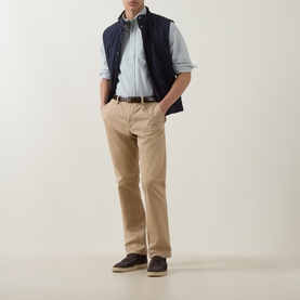 Model wearing Gant Shield Logo Oxford Shirt in Surplus Mint with navy gilet, beige chinos, and dark suede shoes.