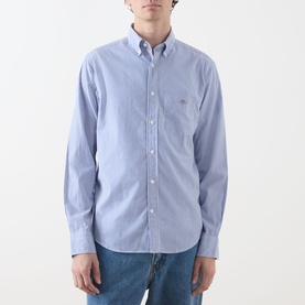 Model wearing Gant Classic Stripe Banker Shirt in College Blue, long sleeves, button-down collar, chest pocket, styled with blue jeans