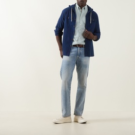 Model wearing Gant Shield Logo Shirt in Surplus Mint with navy hooded overshirt, light wash jeans and white trainers.