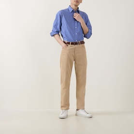 Model wearing Gant Shield Logo Striped Casual Shirt in College Blue, styled with tan chinos, brown belt and white trainers.