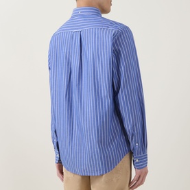 Model wearing Gant Shield Logo Striped Casual Shirt in College Blue, rear view, white stripe cotton, structured cuffs, curved hem, styled with beige