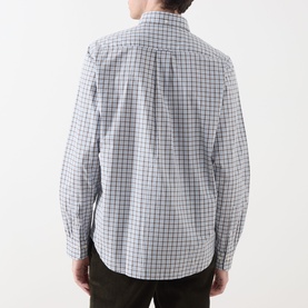 Model wearing Gant Classic Check Logo Shirt in Faded Taupe, rear view showing box pleat, locker loop, and check pattern, styled with dark trousers.