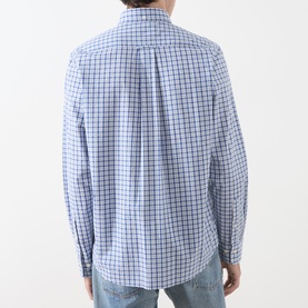 Model wearing Gant Classic Check Logo Shirt in Fresh Blue check, rear view showing box pleat and locker loop, styled with light blue jeans.