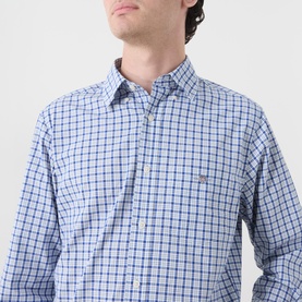 Model wearing Gant Classic Check Logo Shirt in Fresh Blue, button-down collar, long sleeves, embroidered shield logo on chest