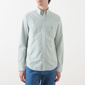 Model wearing Gant Classic Gingham Shirt in Surplus Mint, button-down collar, chest pocket, long sleeves, styled with blue jeans.