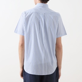 Model wearing Gant Reg Shirt in fresh blue vertical stripe, short sleeves, rear view, styled with navy trousers
