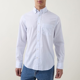 Model wearing Gant light blue stripe cotton regular fit casual shirt with button-down collar and chest pocket, styled with blue jeans