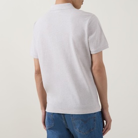 Model wearing Gant Shield Logo Pique Polo Shirt in Glacier Melange, rear view, styled with blue jeans.