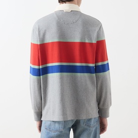 Model wearing Gant Blocked Stripe Rugby Shirt in Grey Melange, rear view, with red and blue chest stripes, ribbed cuffs, styled with light-wash jeans.