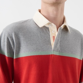Model wearing Gant Blocked Stripe Rugby Shirt in grey melange with red and sage green colour block stripes and classic collar.