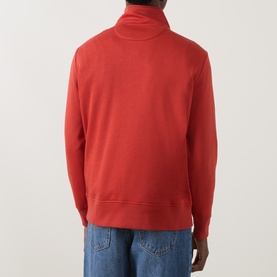 Model wearing Gant Maple Fire half-zip sweatshirt, back view, styled with light blue jeans.