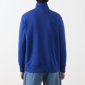 Model wearing Gant Crisp Blue cotton zip-neck sweatshirt, back view, styled with light blue jeans