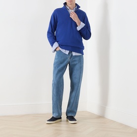 Model wearing Gant Crisp Blue cotton sweatshirt with half-zip collar, styled with light blue shirt and pale wash straight jeans