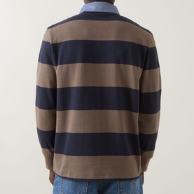 Model wearing Gant Stripe Heavy Rugger Shirt in Faded Taupe, back view showing bold navy and taupe stripes, long sleeves, straight hemline