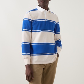 Model wearing Gant Nautical Blue striped cotton rugby sweatshirt with white collar, styled with khaki trousers.