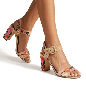 Model wearing Carvela Sadie Embroidered Block Heels in multi, raffia fabric with floral embroidery, ankle strap and gold-tone buckle fastening