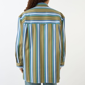 Model wearing The Frankie Shop Oana Padded Stripe Shirt in Green Multi Stripe, rear view showing dropped shoulders and long sleeves