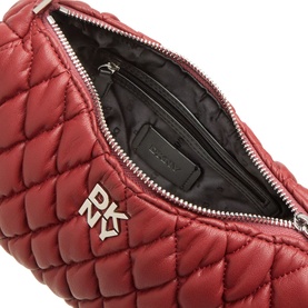 DKNY Remy Quilted Shoulder Bag in Rhythm Red, open interior view showing black lining, zip pocket, and silver-tone DKNY logo hardware