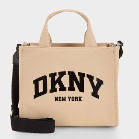 DKNY Hadlee Medium Tote Bag in khaki canvas with bold black logo branding, black top handles, adjustable black crossbody strap