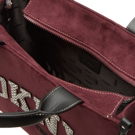 DKNY Hadlee Medium Tote Bag in Aged Wine faux suede, open top view showing interior zip pocket and logo-branded exterior detail, silver-tone hardware