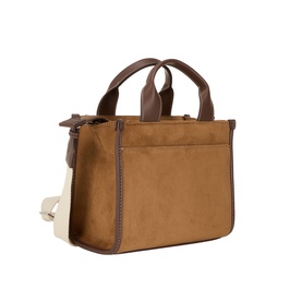 DKNY almond suede tote bag with dark brown leather trim, dual top handles, side zip pocket, and cream canvas side panel