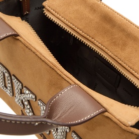 DKNY almond suede tote bag, open top view showing interior zip pocket, crystal logo detail, brown leather trim and handles