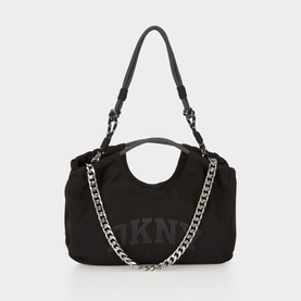 DKNY Mabel Large Tote Bag in black nylon with silver-tone chain strap, carry handles, and embossed logo detail