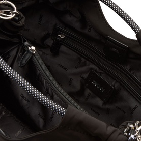 DKNY Mabel Large Tote Bag in black with silver-tone hardware, showing interior view with zip pockets and branded black lining