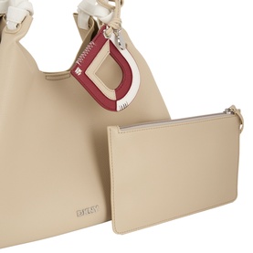 DKNY light taupe leather tote bag with red and gold D-ring charm, shown with matching zip pouch clutch included