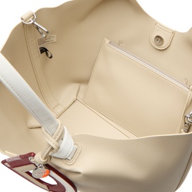 DKNY light taupe tote bag interior view showing main compartment, zip pocket, and white adjustable crossbody strap with silver hardware