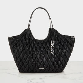 DKNY Paula Quilted Medium Tote Bag in black with silver-tone hardware, diamond-quilted finish, dual top handles and logo charm detail